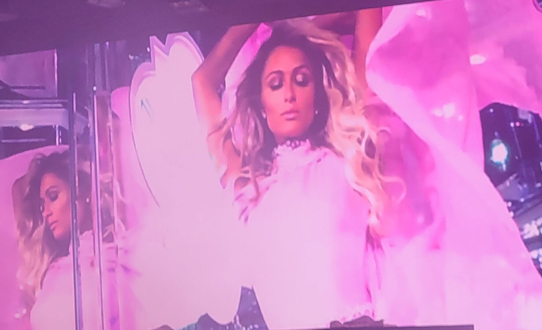 Paris Hilton in pink, on stage.