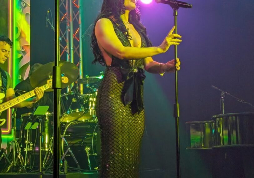 Female singer in long sequined gown