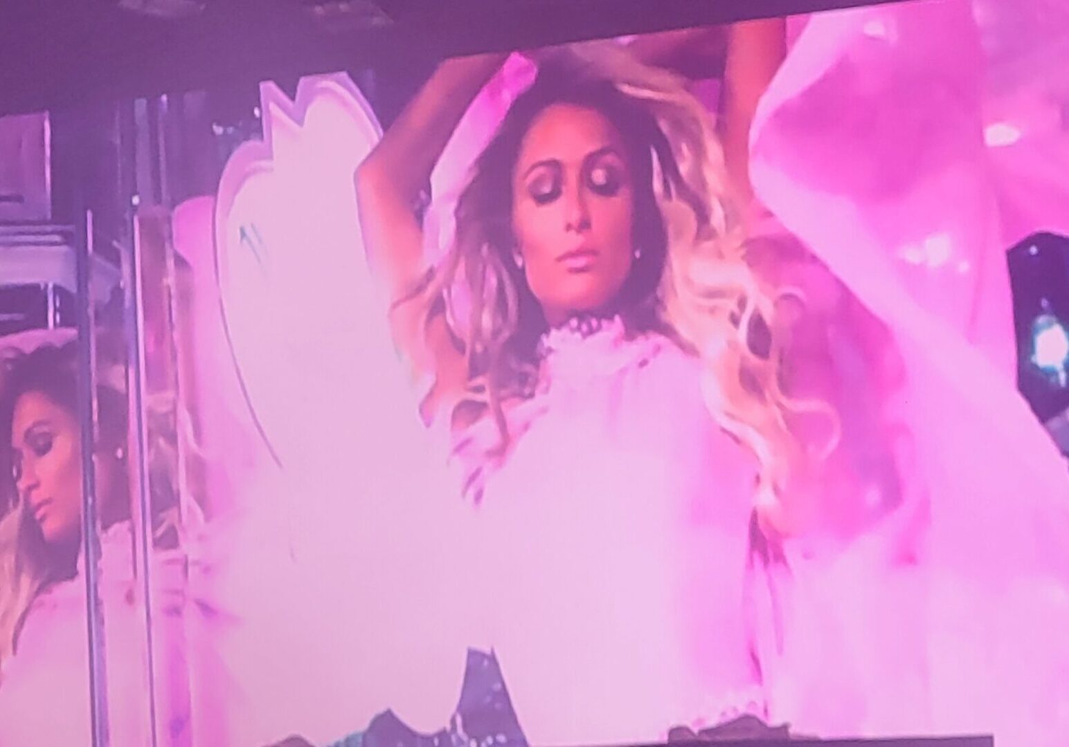 Paris Hilton in pink, on stage.