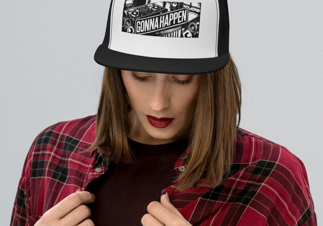 Person wearing trucker hat with "Gonna Happen"