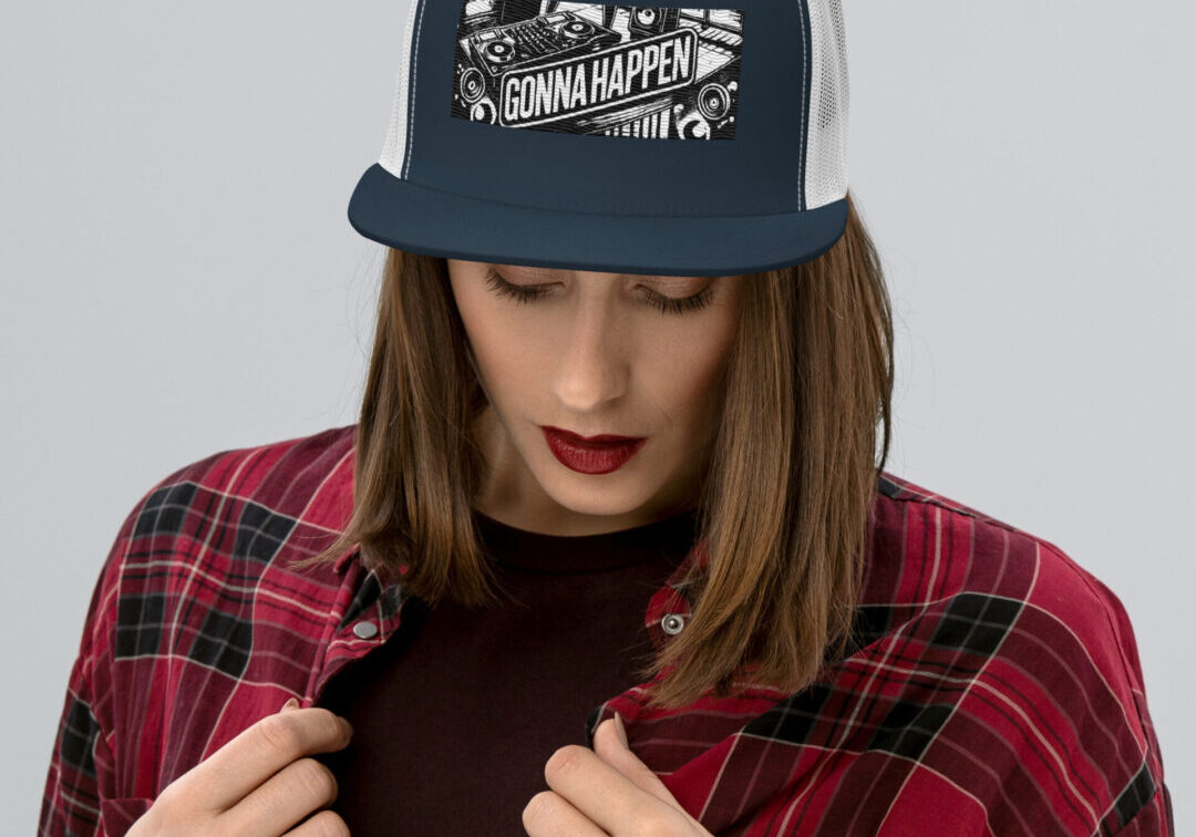 Woman wearing navy trucker hat reading "Gonna Happen"