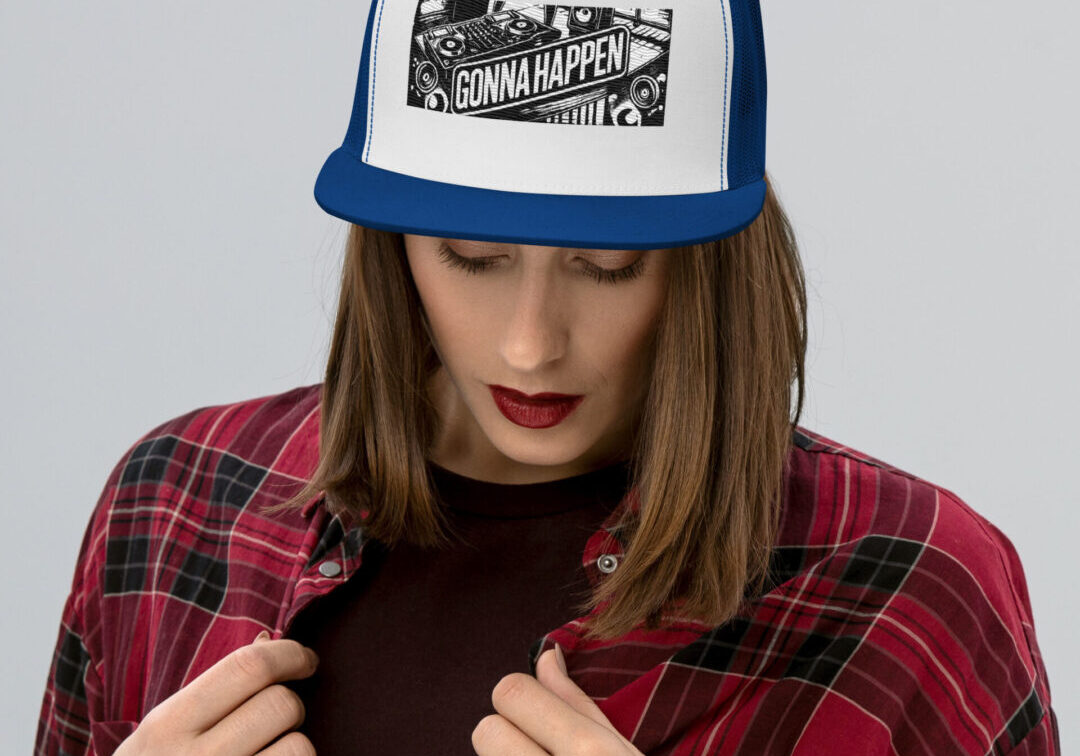 Woman wearing blue trucker hat with "Gonna Happen"