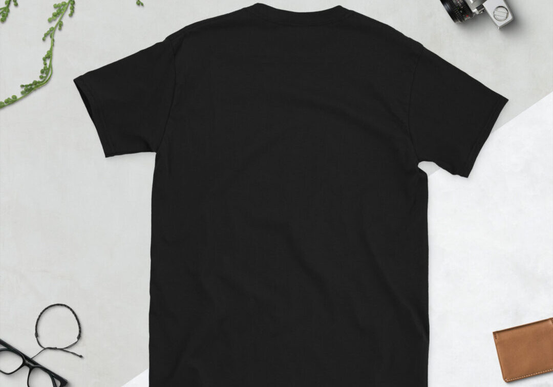 Black t-shirt on flat lay background.