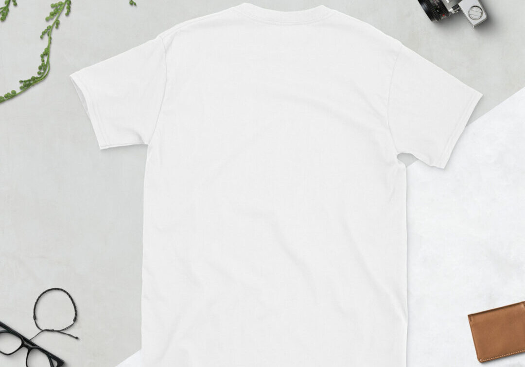 White t-shirt flatlay with accessories
